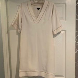 Creamy white short-sleeve sheath with lattice detail